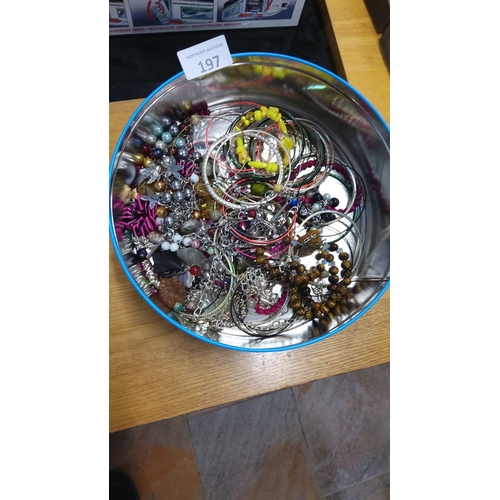 197 - Collection of assorted costume jewelry bangles and bracelets in various materials and colors.