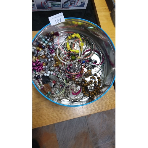 197 - Collection of assorted costume jewelry bangles and bracelets in various materials and colors.