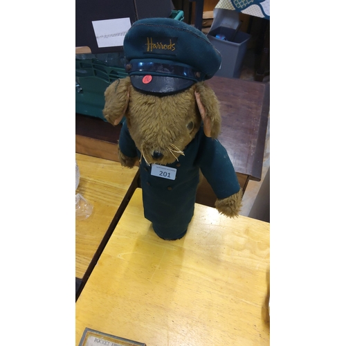 201 - Plush teddy bear in uniform, featuring embroidered cap and coat.