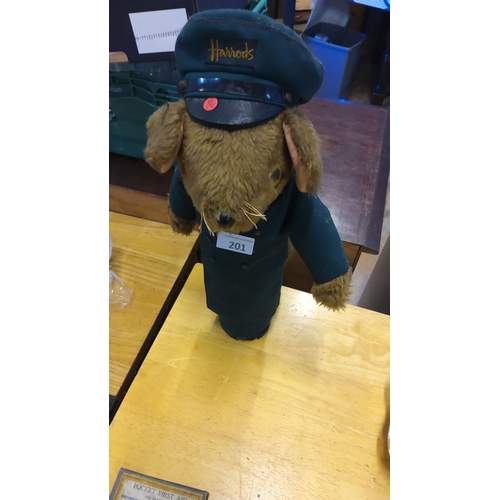 201 - Plush teddy bear in uniform, featuring embroidered cap and coat.
