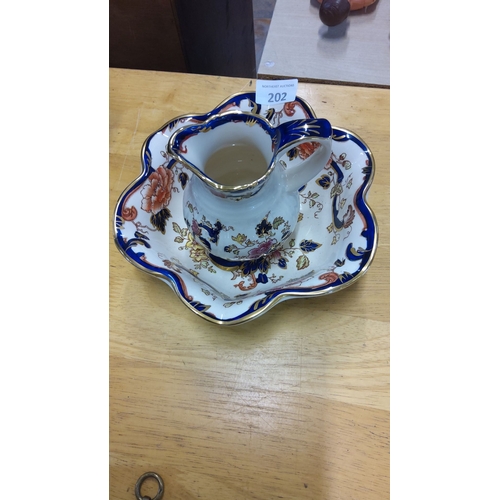 202 - Mason's Ironstone jug and bowl mandalay set, featuring vibrant floral motifs, printed and hand-paint... 