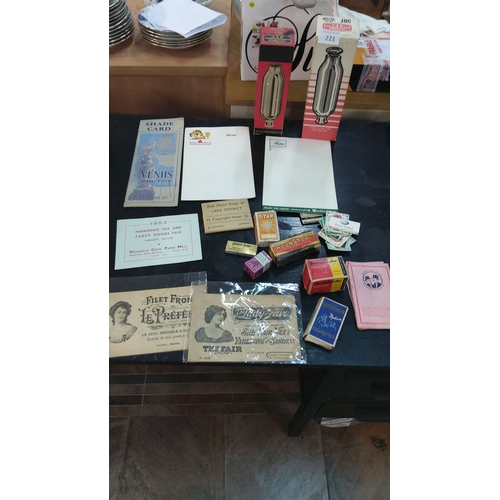 221 - Mixed lot includes mid-20th century ephemera, cigarette boxes, vintage menus, paper samples, and Lak... 