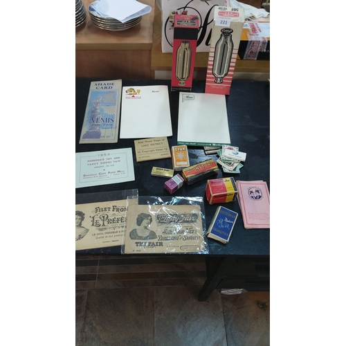 221 - Mixed lot includes mid-20th century ephemera, cigarette boxes, vintage menus, paper samples, and Lak... 