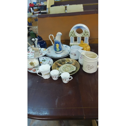 224 - Mixed lot of decorative ceramics including jugs, teapots, cups, and serving plates with floral motif... 