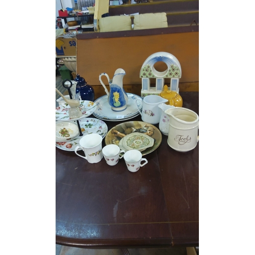 224 - Mixed lot of decorative ceramics including jugs, teapots, cups, and serving plates with floral motif... 