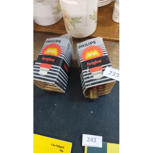 233 - Two Philips Fireglow red light bulbs in original packaging.