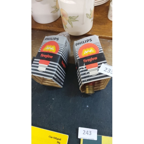 233 - Two Philips Fireglow red light bulbs in original packaging.