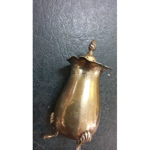 238 - Pair of sterling silver salt and pepper shakers, hallmarked, feature ornate twisted finials and foot... 