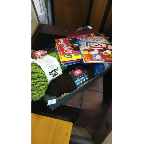 320 - Assorted crafting materials including yarn and knitting books.