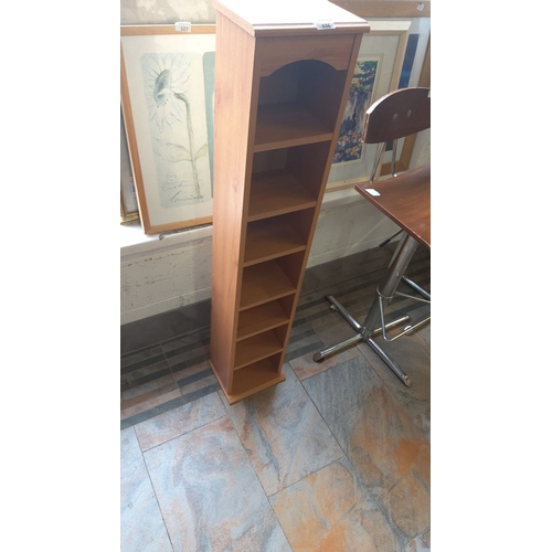 326 - Tall wooden storage tower with multiple shelves, in oak finish.