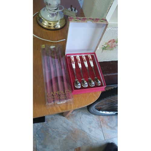 331 - Set of four Santa-themed spoons with ceramic handles, boxed. Accompanied by a pack of red candles, n... 