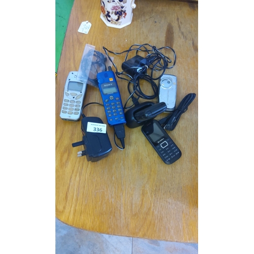 336 - Collection of vintage mobile phones and accessories, featuring models by Sony and Sony Ericsson with... 