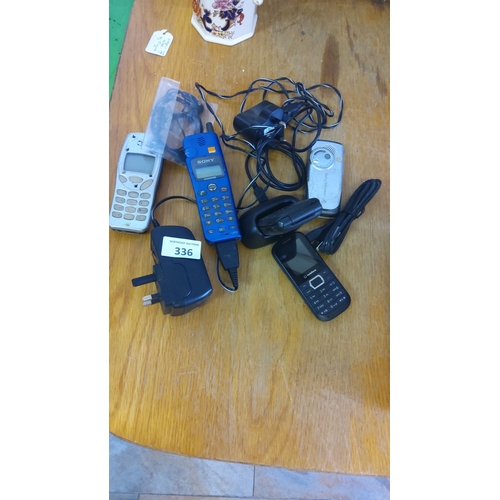 336 - Collection of vintage mobile phones and accessories, featuring models by Sony and Sony Ericsson with... 
