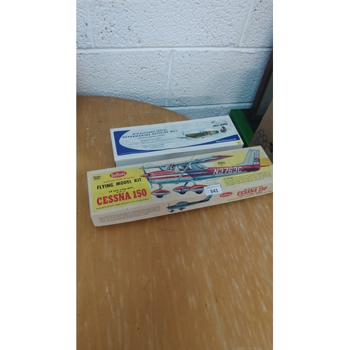 341 - Guillow's Cessna 150 flying model kit and West Wings Supermarine Spitfire Mk1 balsa wood kit. Authen... 