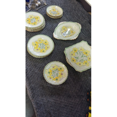 350 - Bone China plate set features vibrant yellow floral design with gold accents