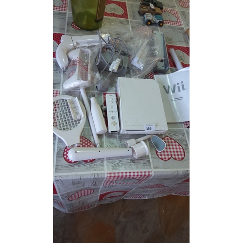 355 - Nintendo Wii console with remote, attachments, and operations manual.(no sensor included)