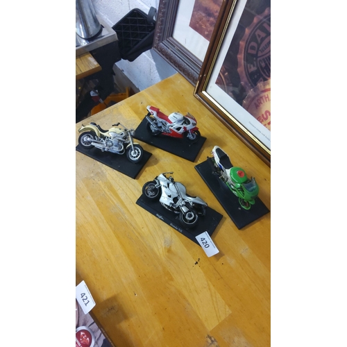 420 - Set of four model motorcycles featuring detailed designs, including a Yamaha and Honda NR. Each disp... 