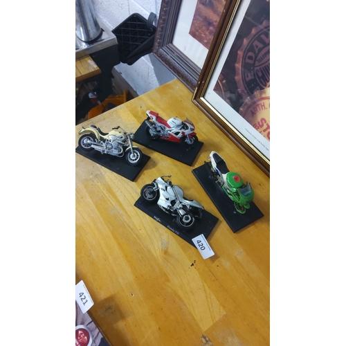 420 - Set of four model motorcycles featuring detailed designs, including a Yamaha and Honda NR. Each disp... 
