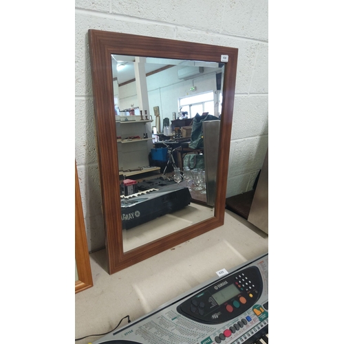 438 - Rectangular wall mirror with a wooden frame, contemporary design.