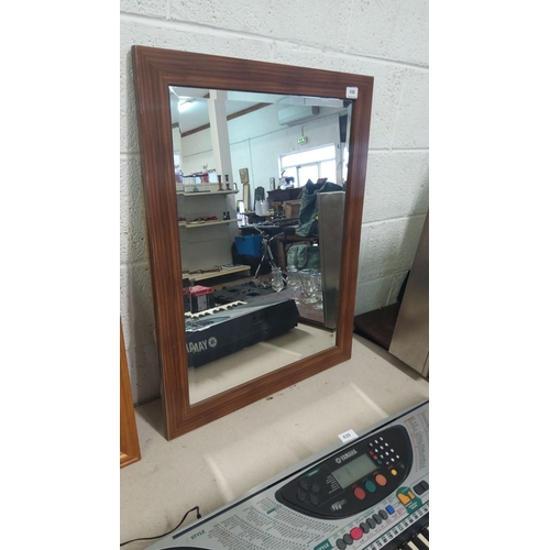 438 - Rectangular wall mirror with a wooden frame, contemporary design.