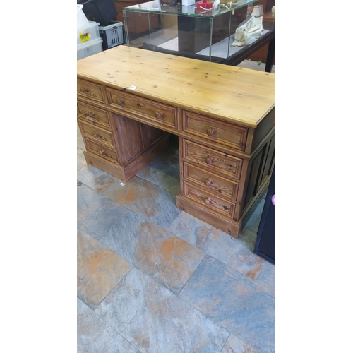 445 - Antique pine wood desk featuring multiple drawers with turned wooden knobs.