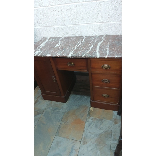 453 - Mahogany sideboard with marble top. Features brass handles, four drawers, and a cupboard. Mid-centur... 