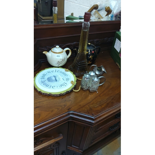 455 - Mixed lot includes a Bewley's teapot, Eiffel Tower bottle, decorative sign, black teapot, and a set ... 