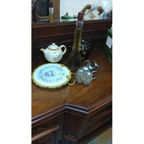 455 - Mixed lot includes a Bewley's teapot, Eiffel Tower bottle, decorative sign, black teapot, and a set ... 