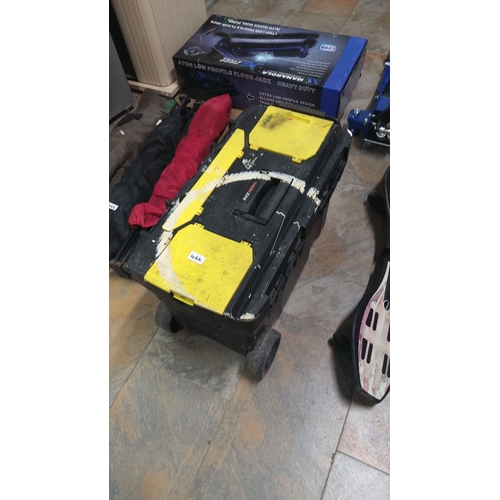 466 - Heavy-duty rolling tool chest has durable yellow and black plastic construction. It features a centr... 