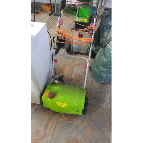 476 - Florabest electric lawn scarifier, model FLV 1300/8, has a vibrant green exterior with an ergonomic ... 