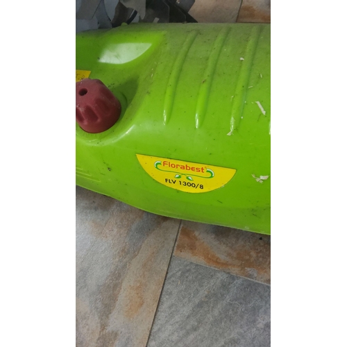 476 - Florabest electric lawn scarifier, model FLV 1300/8, has a vibrant green exterior with an ergonomic ... 
