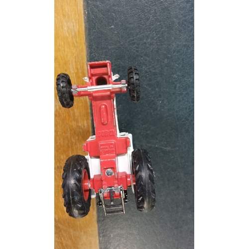 49 - Corgi die-cast model of a David Brown 1412 tractor features red and white paintwork with black detai... 