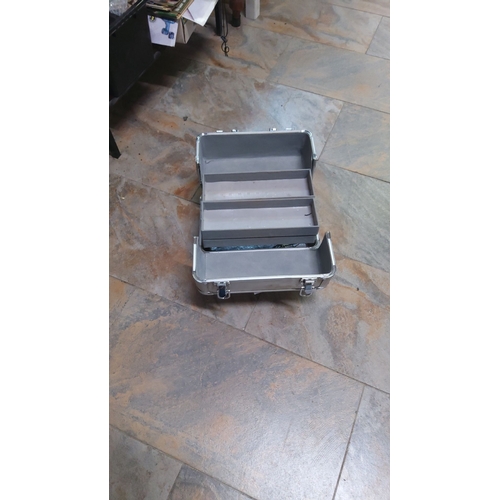 132 - Aluminum storage case with handle features a dual-layered interior. Sturdy clasps ensure secure clos... 