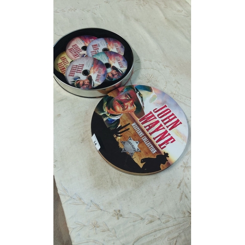 14 - John Wayne DVD set featuring classic films in a decorative tin case. Includes multiple discs of icon... 