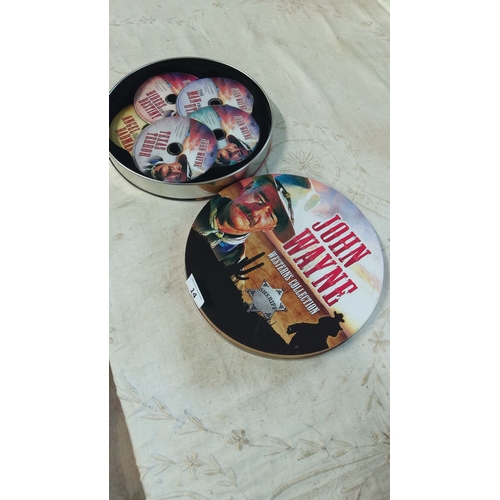 14 - John Wayne DVD set featuring classic films in a decorative tin case. Includes multiple discs of icon... 