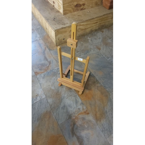 154 - Wooden tabletop easel, adjustable design for small canvases, made with natural wood finish.