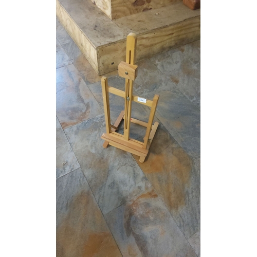 154 - Wooden tabletop easel, adjustable design for small canvases, made with natural wood finish.