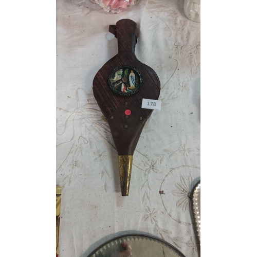 178 - Antique bellows with a Lourdes-themed painted medallion, featuring brass tip and wooden construction... 