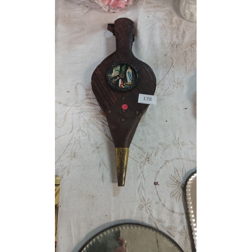 178 - Antique bellows with a Lourdes-themed painted medallion, featuring brass tip and wooden construction... 