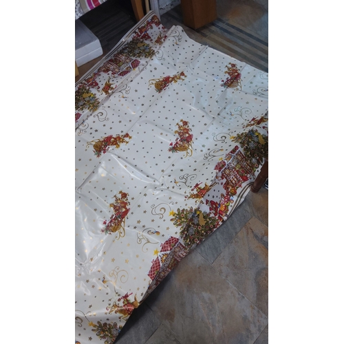 222 - Xmas wipe clean table cover with Santa and sleigh design, accented by stars and Christmas motifs.(8f... 