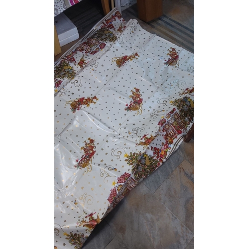 222 - Xmas wipe clean table cover with Santa and sleigh design, accented by stars and Christmas motifs.(8f... 