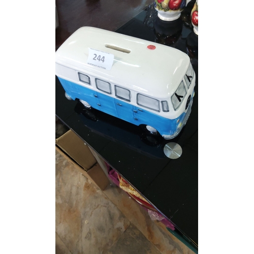 244 - Ceramic money box shaped like a vintage VW campervan, hand-painted in blue and white, featuring coin... 