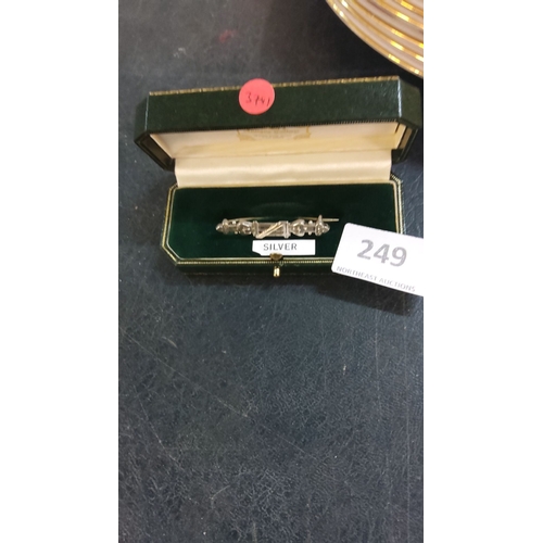 249 - Sterling silver bar brooch with geometric design, housed in a fitted box.