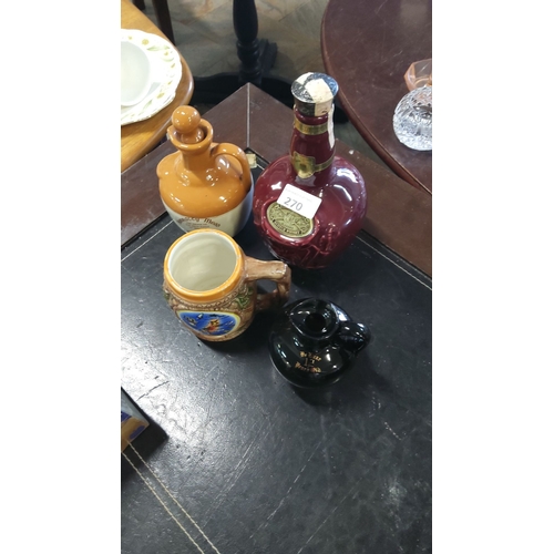 270 - Assorted vintage liquor decanters, featuring ceramics and glass, including a Dimple Scotch Whisky bo... 