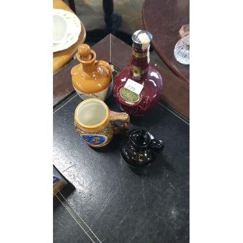 270 - Assorted vintage liquor decanters, featuring ceramics and glass, including a Dimple Scotch Whisky bo... 