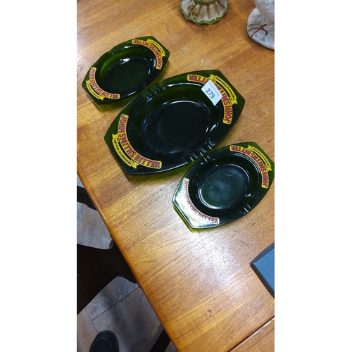 279 - Set of three vintage John Smiths Bitter green glass ashtrays with yellow and red branding.