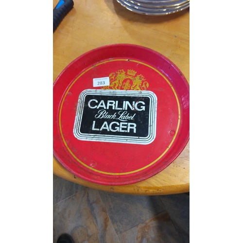 283 - Vintage Carling Black Label Lager tray with vibrant red and black design. Features classic branding ... 