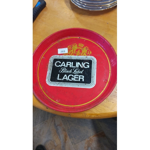 283 - Vintage Carling Black Label Lager tray with vibrant red and black design. Features classic branding ... 