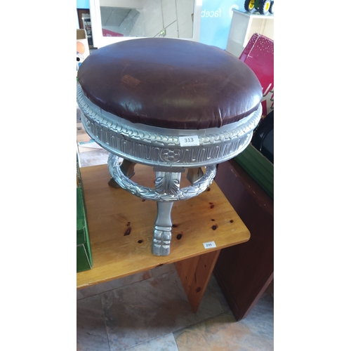 313 - Leather upholstered stool on ornate silver coloured base