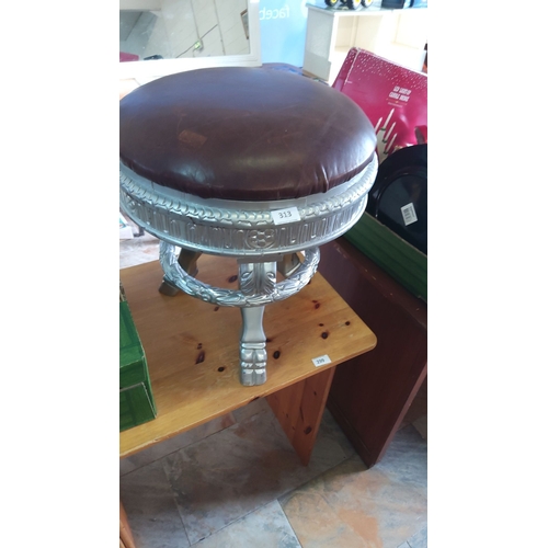 313 - Leather upholstered stool on ornate silver coloured base